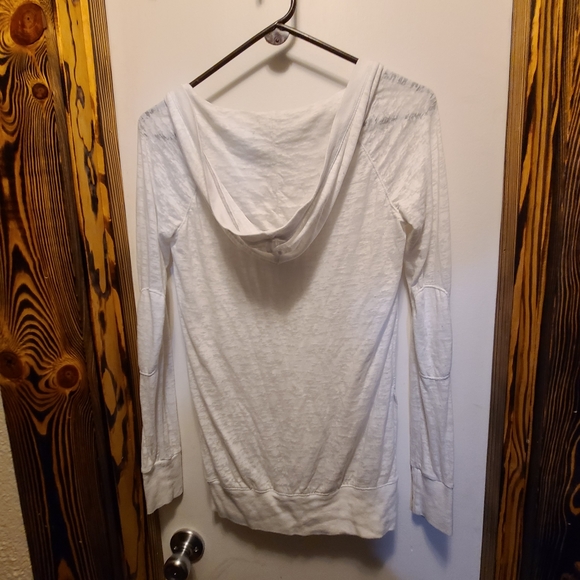 White long sleeve hooded Tee shirt with pocket for hands on front. - Picture 2 of 5